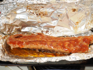 Ribs brushed with barbecue sauce