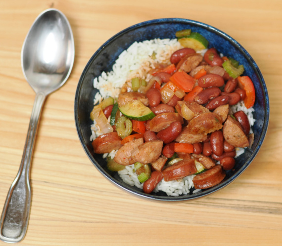 A bowl of red beans and rice with andouille sausage