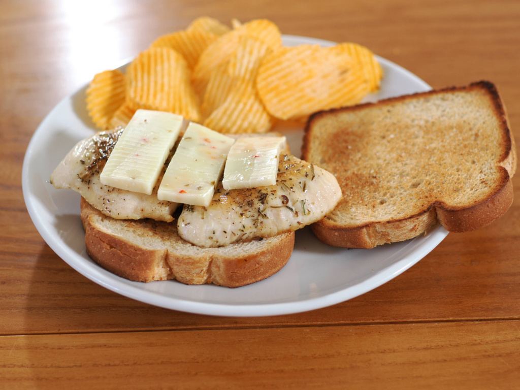 Sauteed Chicken Breast on toast with pepper jack cheese.
